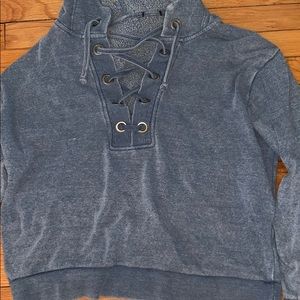 blue sweatshirt with laces in the front